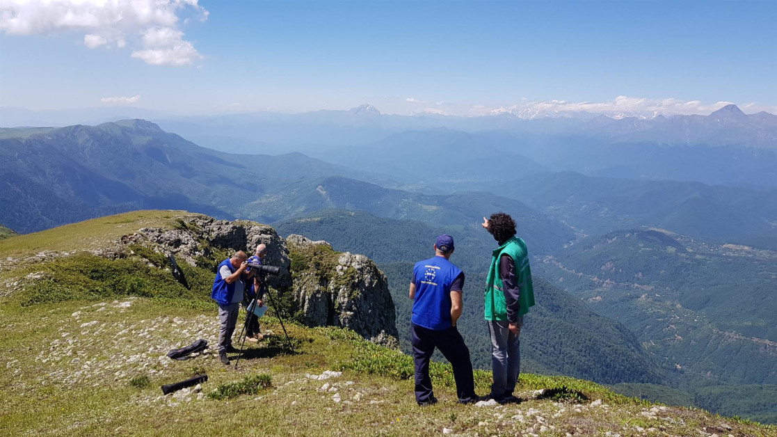 EU staff watching over mountains with a camera