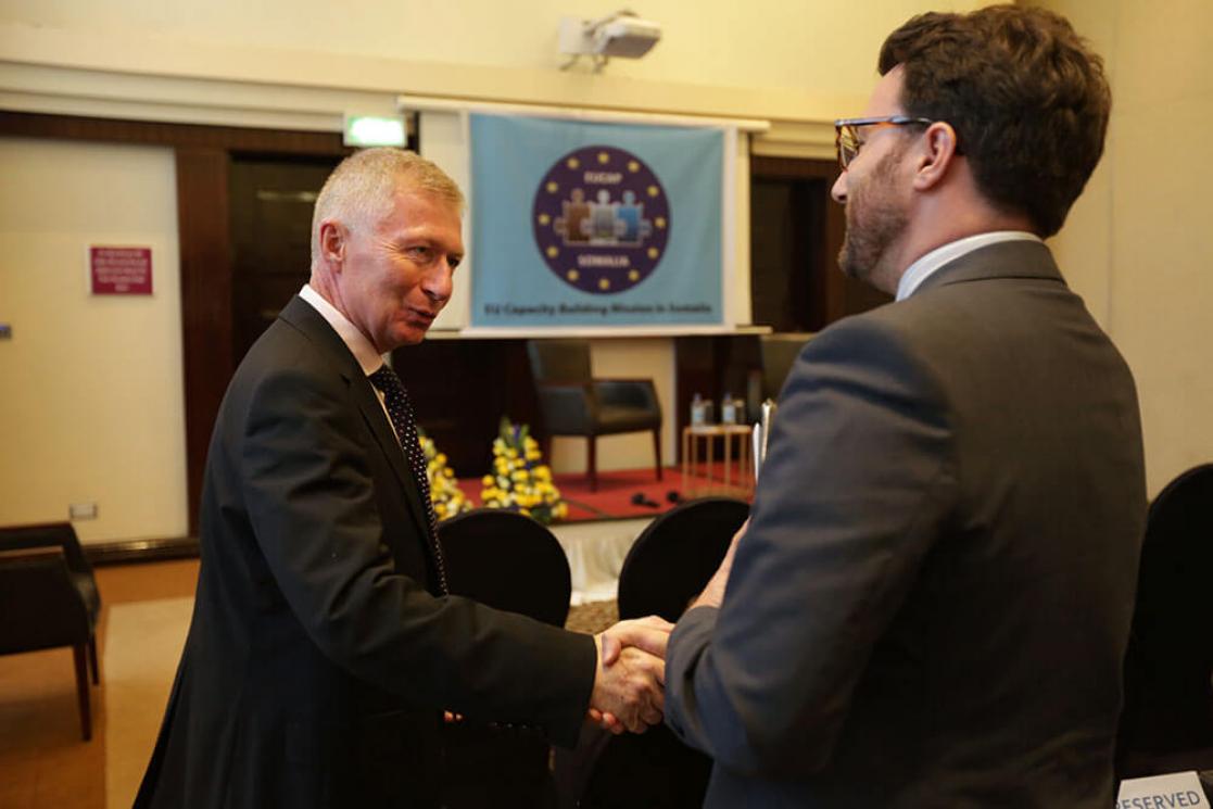 two people shaking hands 