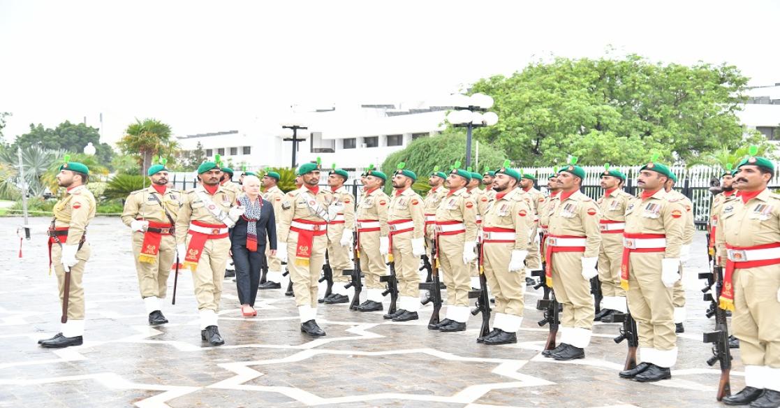 Escorted to the venue in an official horse-drawn carriage and give a guard of honour by a contingent of the armed forces of Pakistan