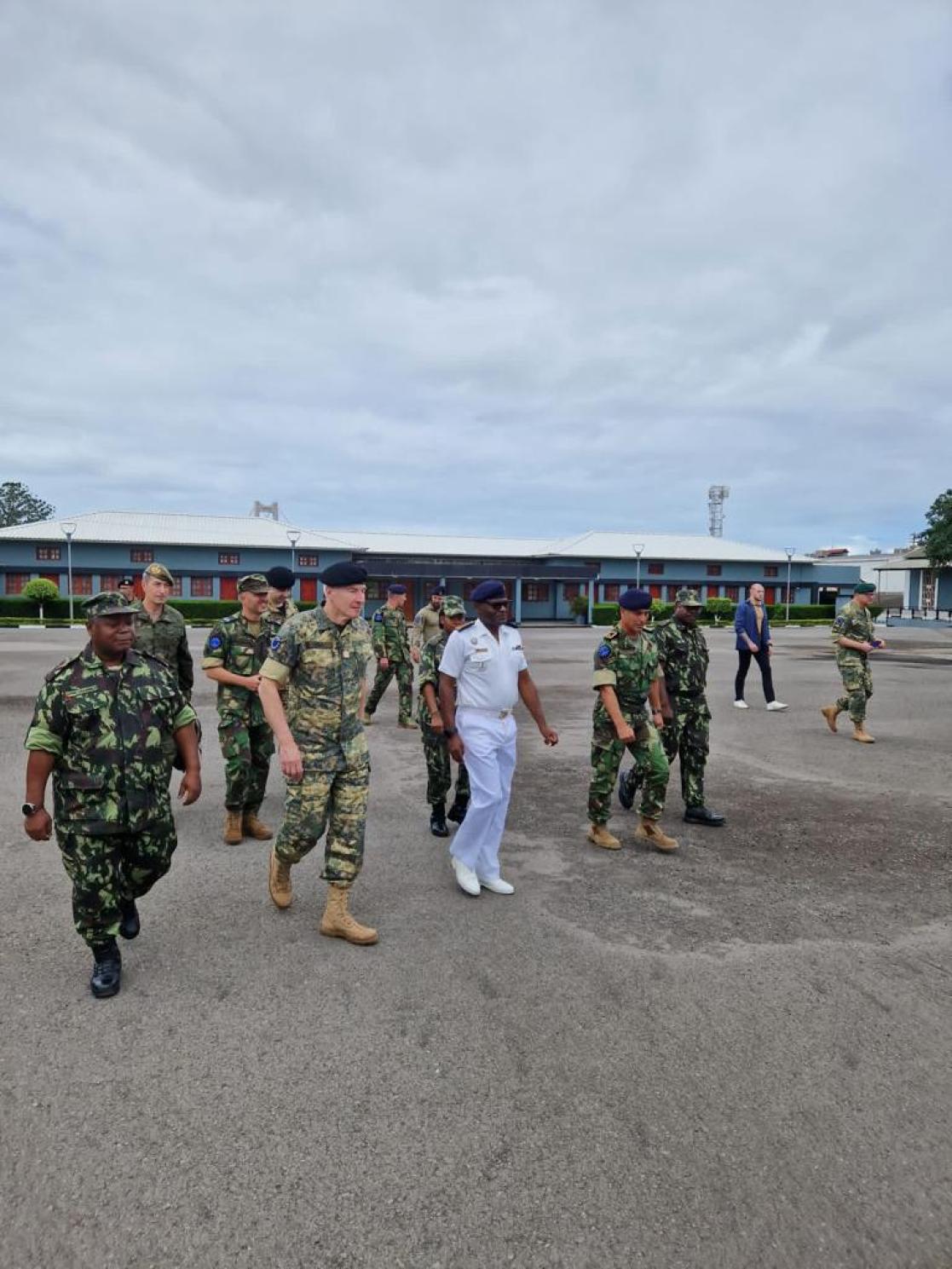 People in military uniform walking