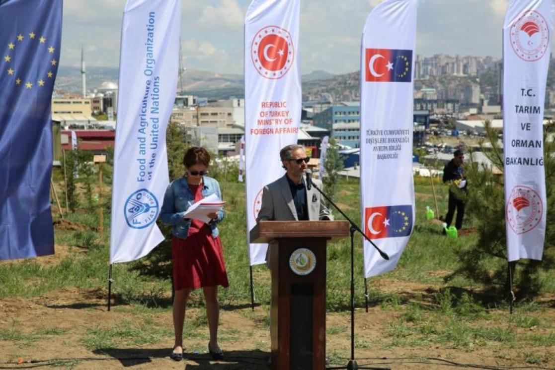 a man is doing a speech for the Conference 
