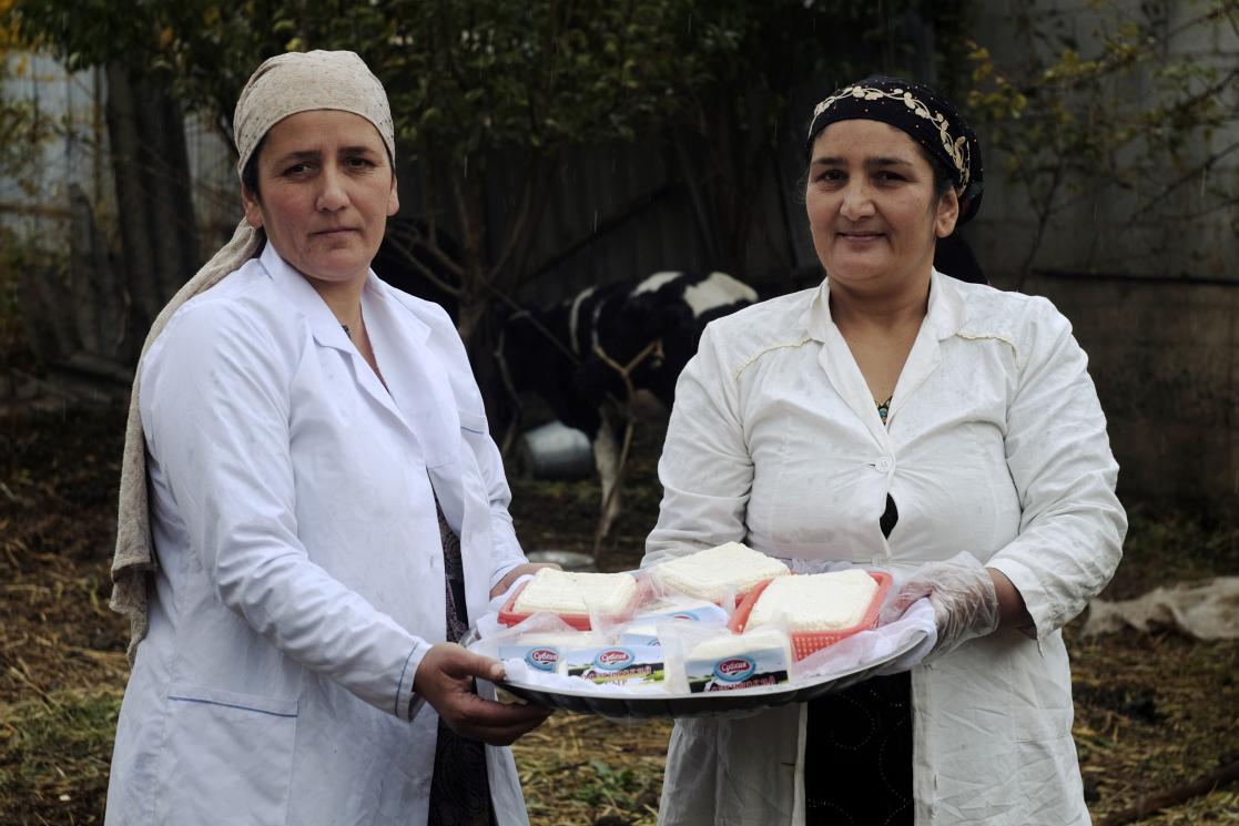 Women showing some dairy products