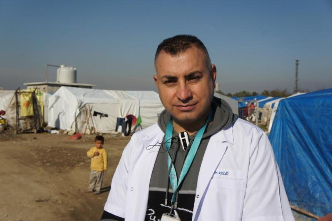 Men in a refugee camp