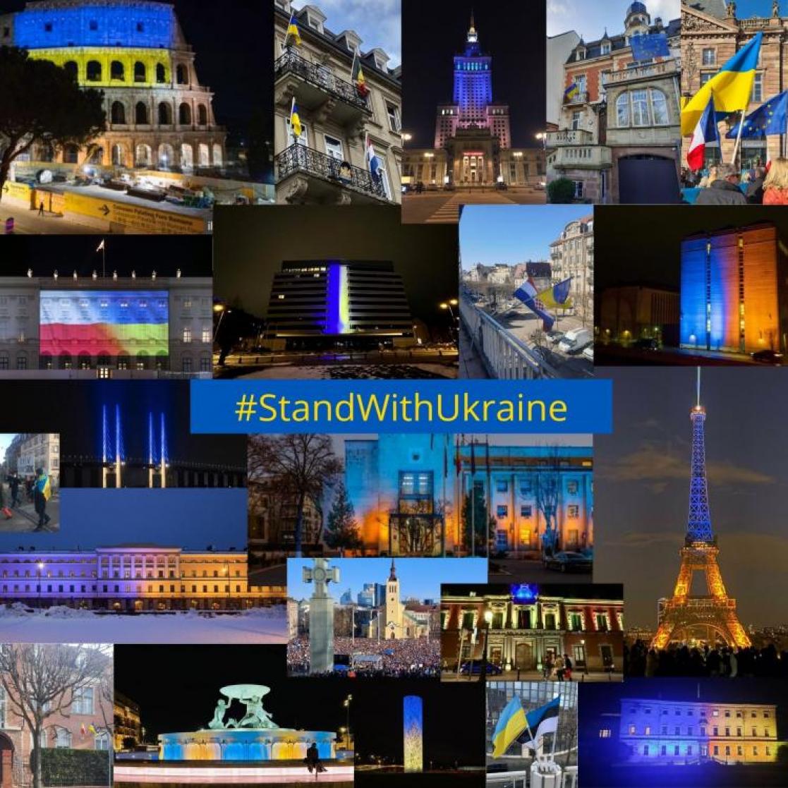 Buildings lit up in blue and yellow, colors of the Ukraine flag