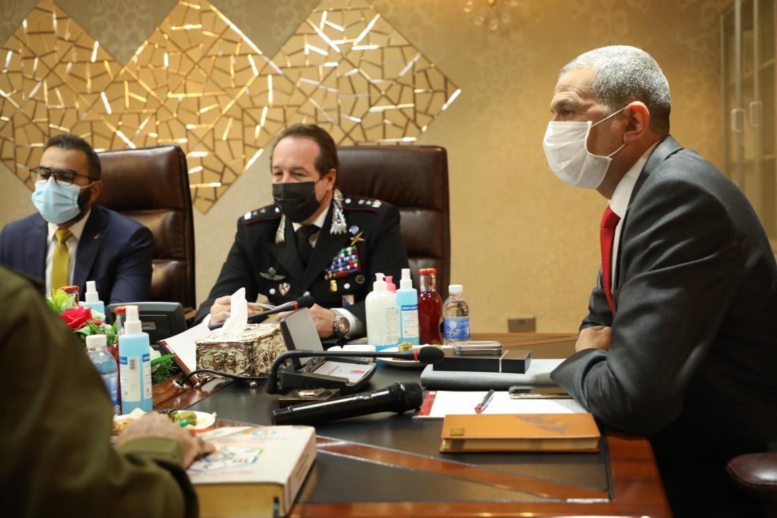 Three people listening in a meeting