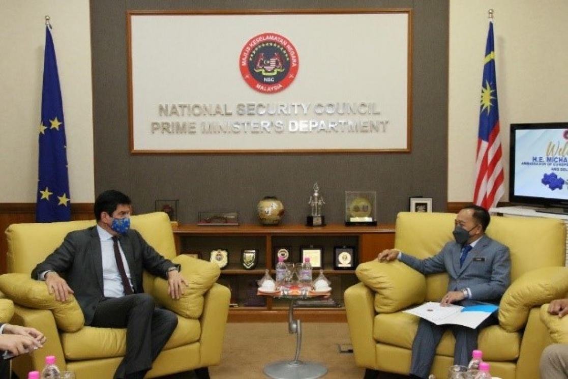 Two men talking during a reception
