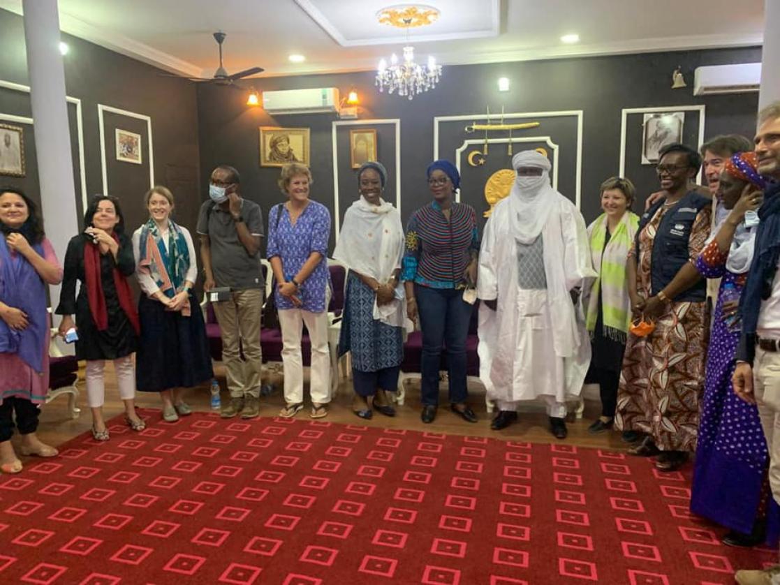 Group of people posing standing