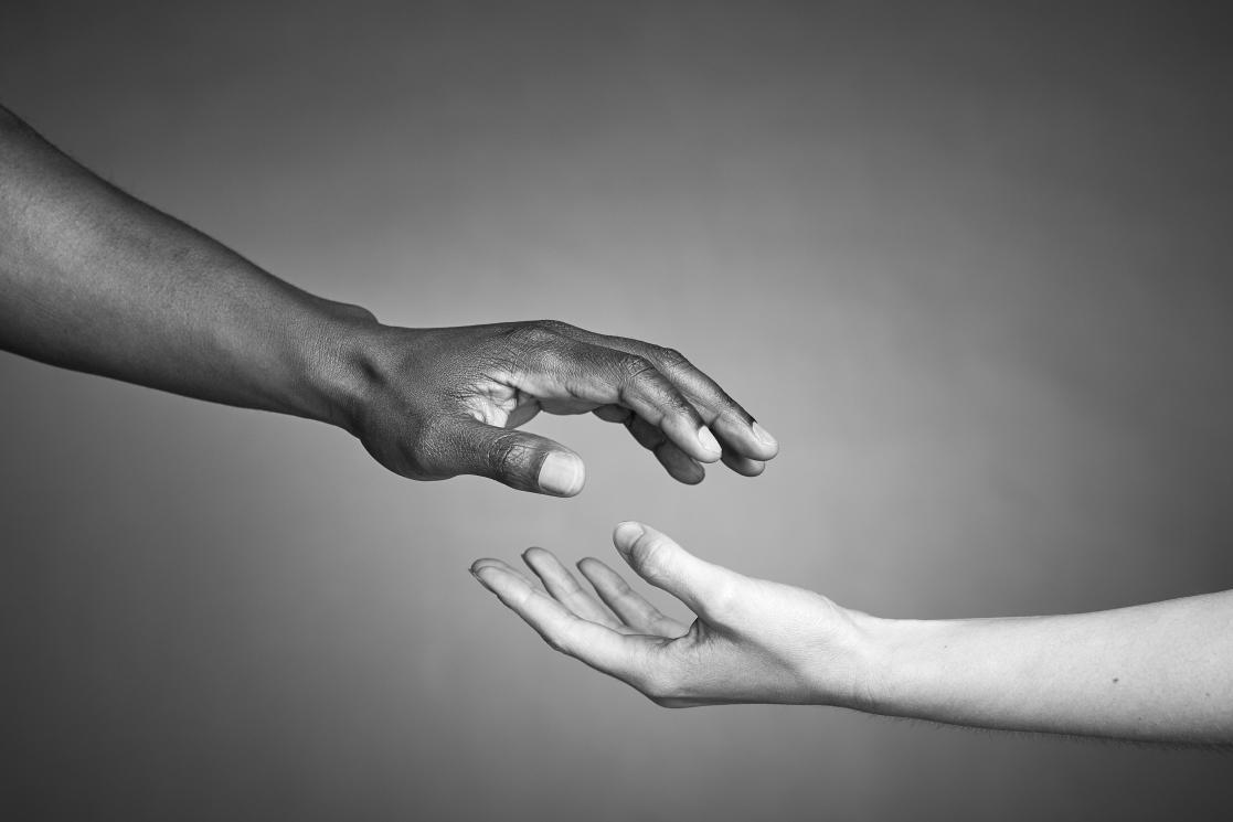 Two people holding hands