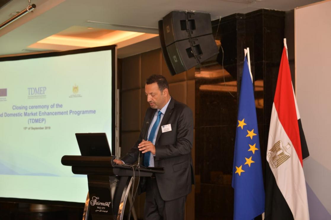 Man talking into a lectern
