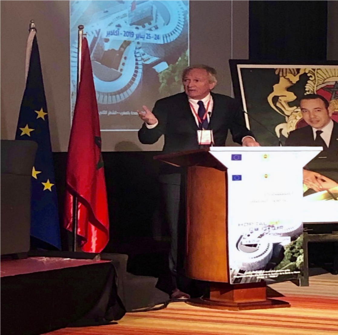 Man talking into a lectern