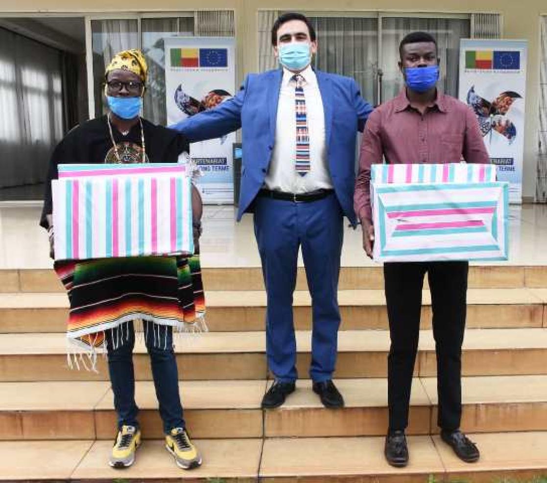 People with boxes of material