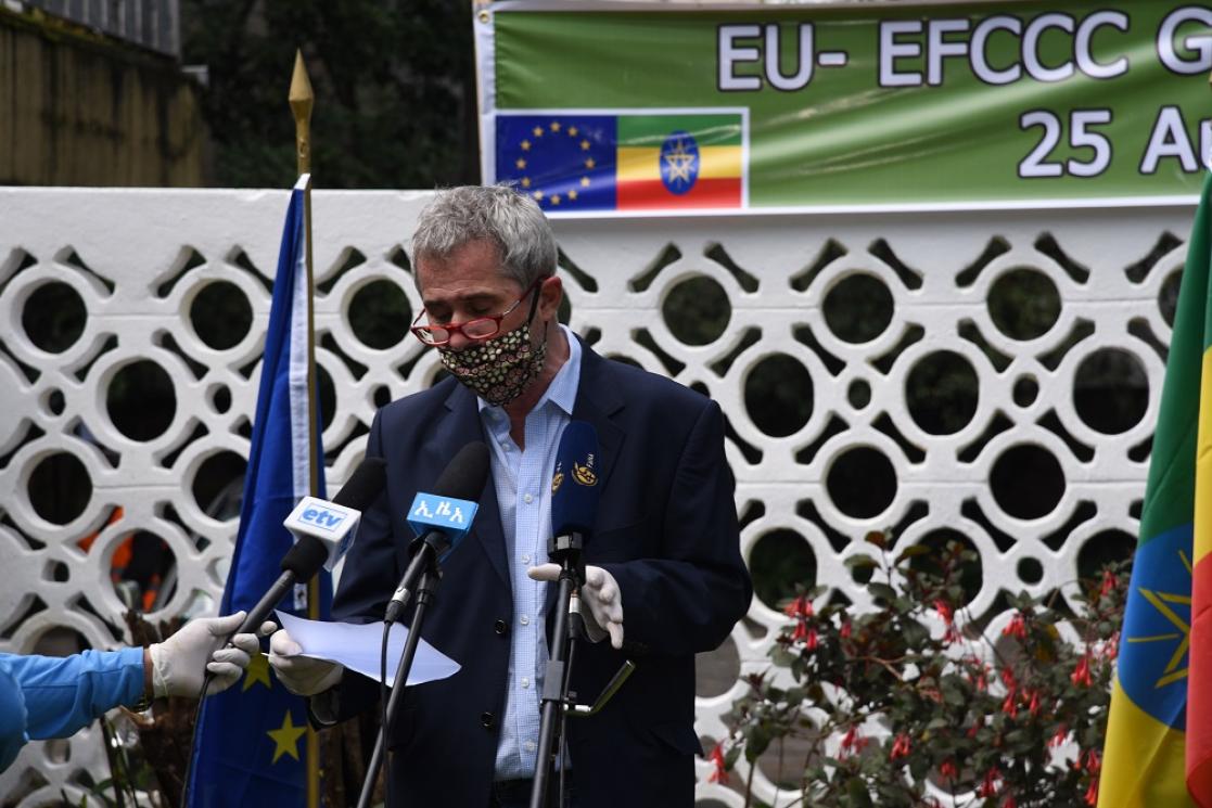Man attending to the media