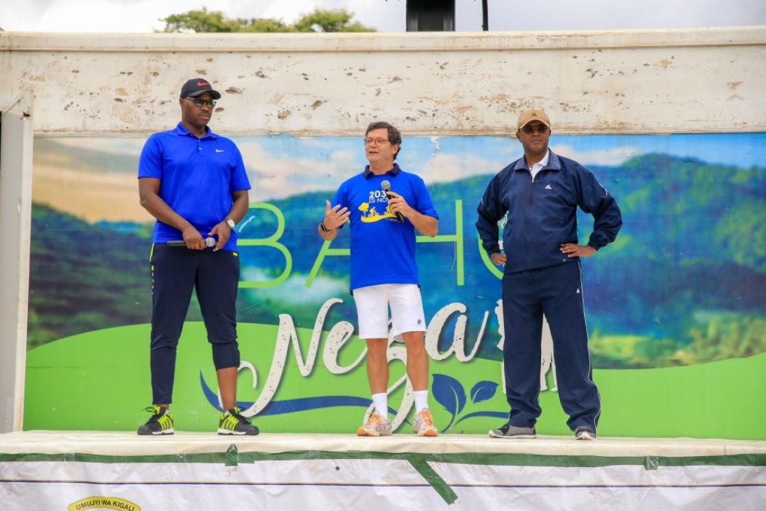 Three men talking during an event