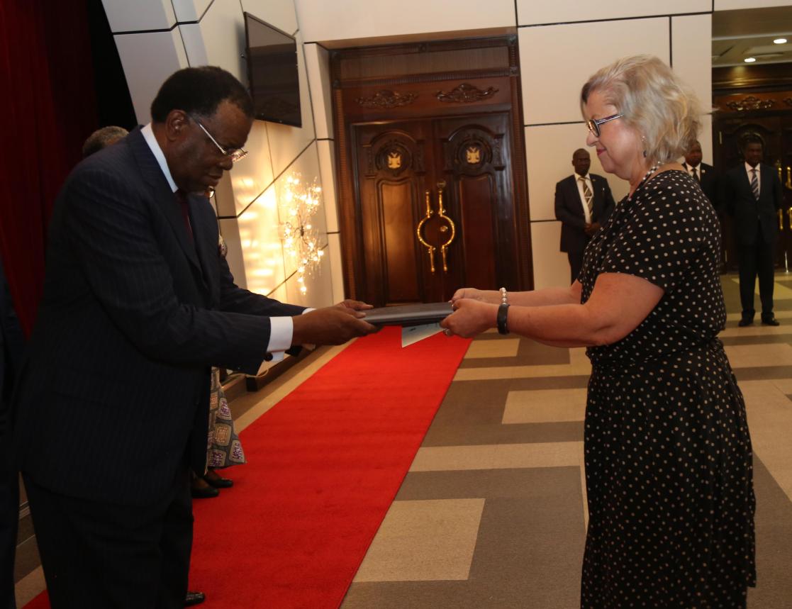 person receiving a document from another person