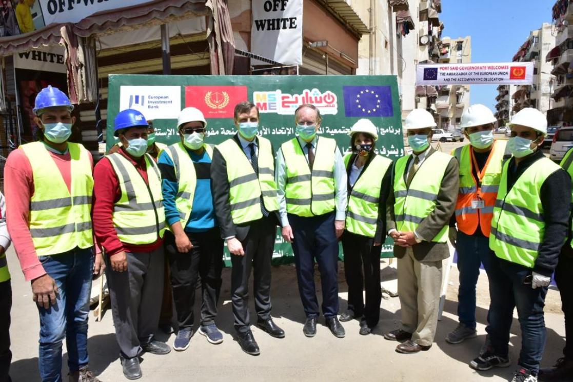 Group of people wearing reflective waistcoats