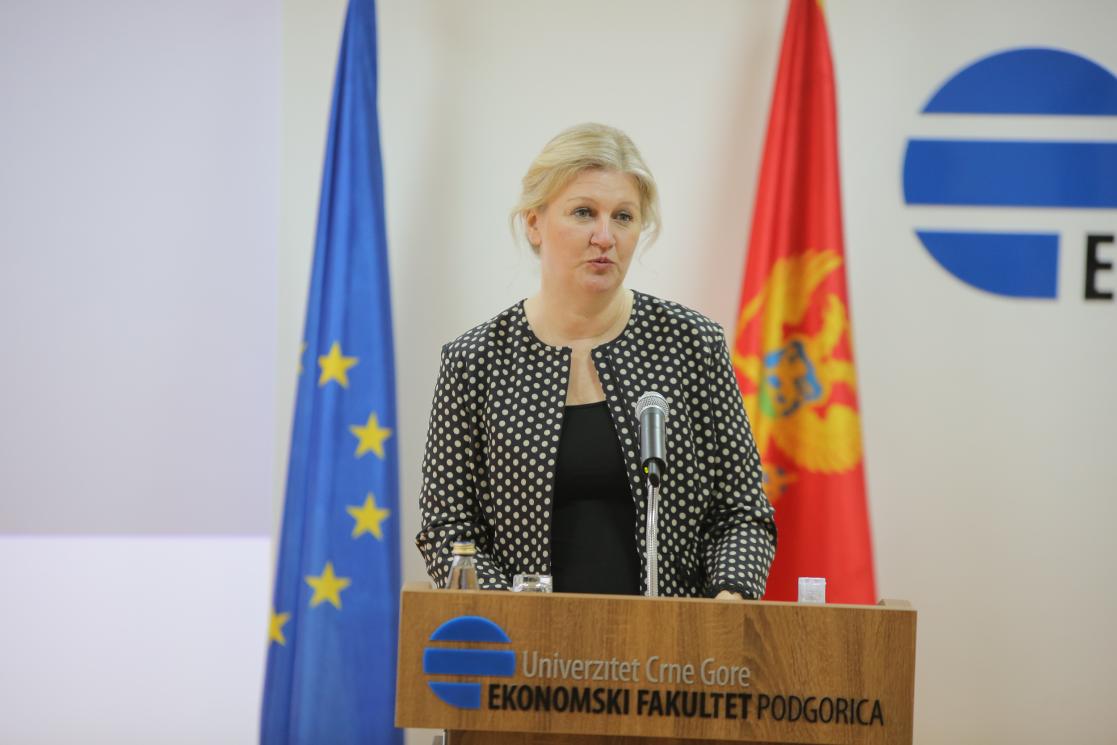 Woman talking into a lectern