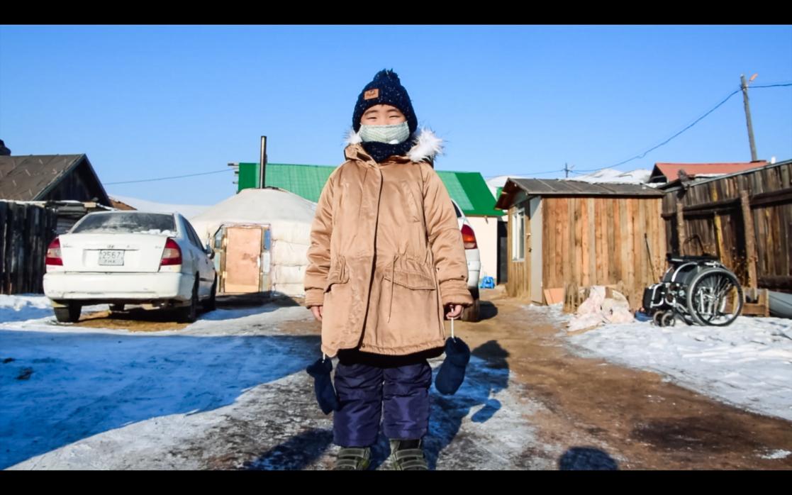 Child posing in the snow