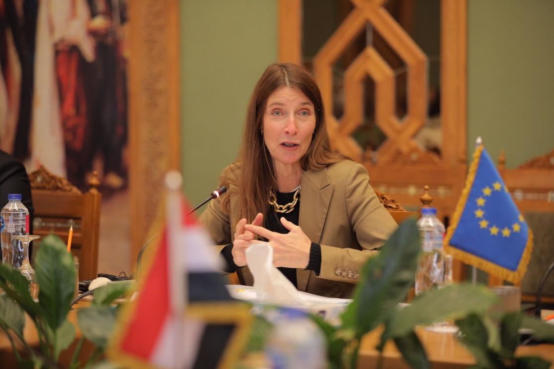 Woman talking into a microphone