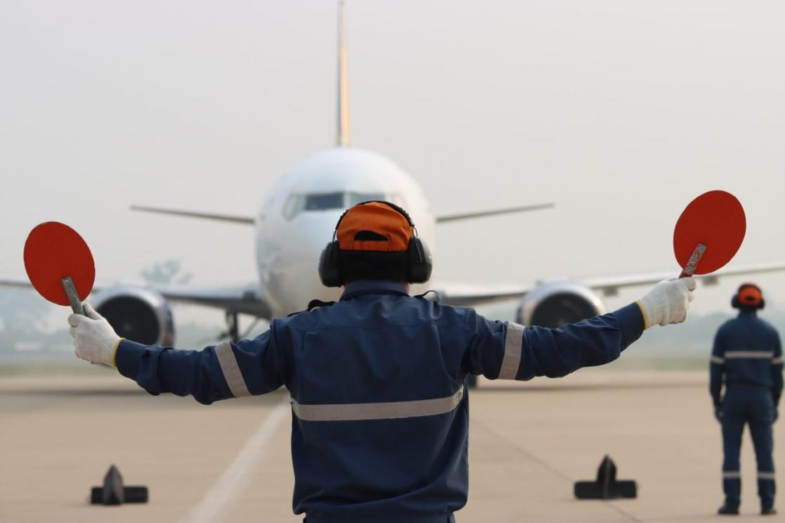 Person signalling an aircraft