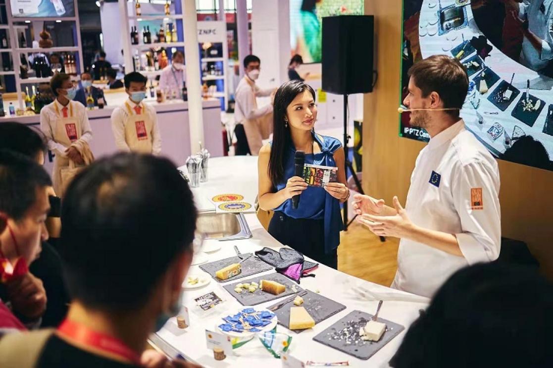 Cook doing a cooking show at an event stand