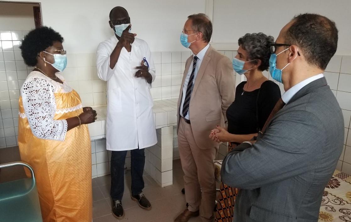 A doctor speaking to a group of people