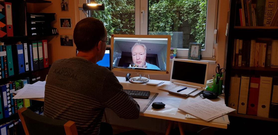 Man having a virtual meeting in his office