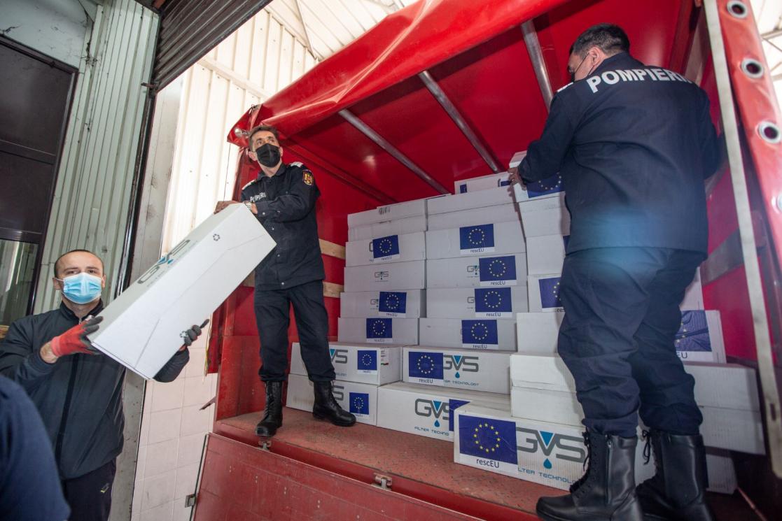 People removing material from a truck