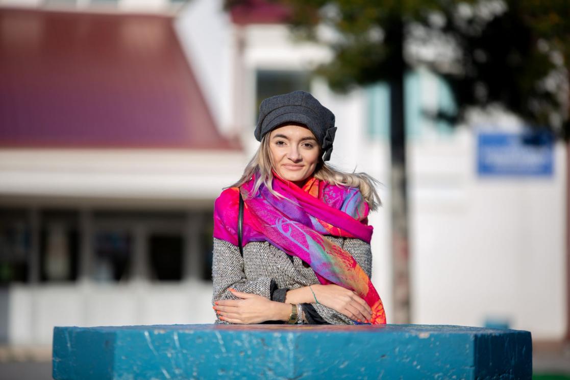Young woman smiling to the camera