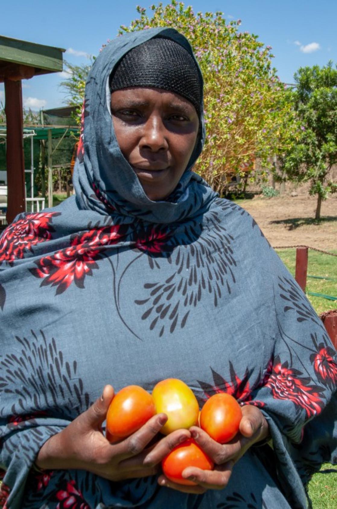 Woman with tomatoes in her hands