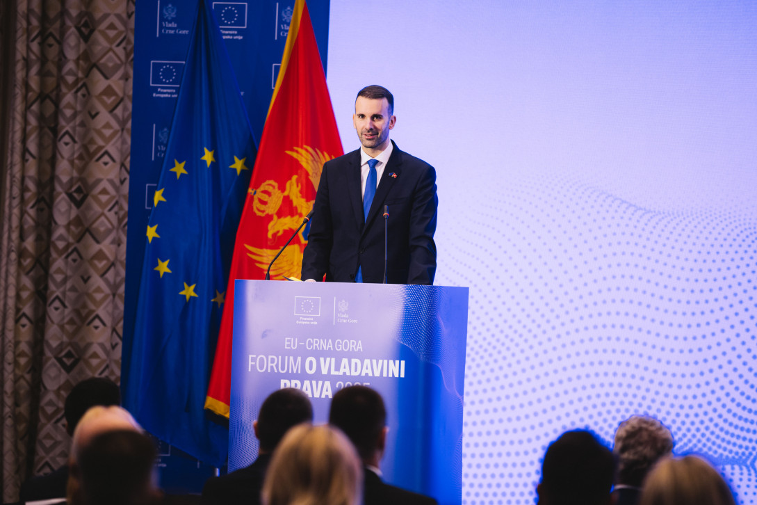 Prime Minister Spajić standing behind the lectern