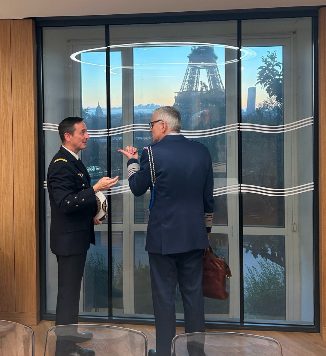 Two people in uniform talking to each other