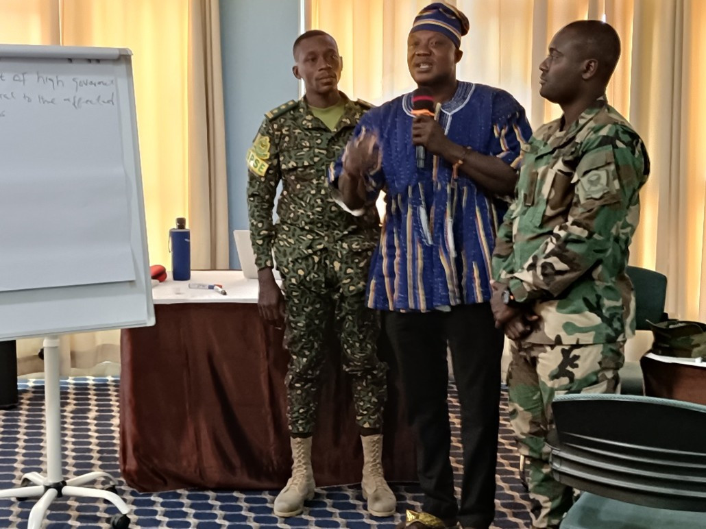 Participants and civilian representatives presenting the results of the discussion from the workshop