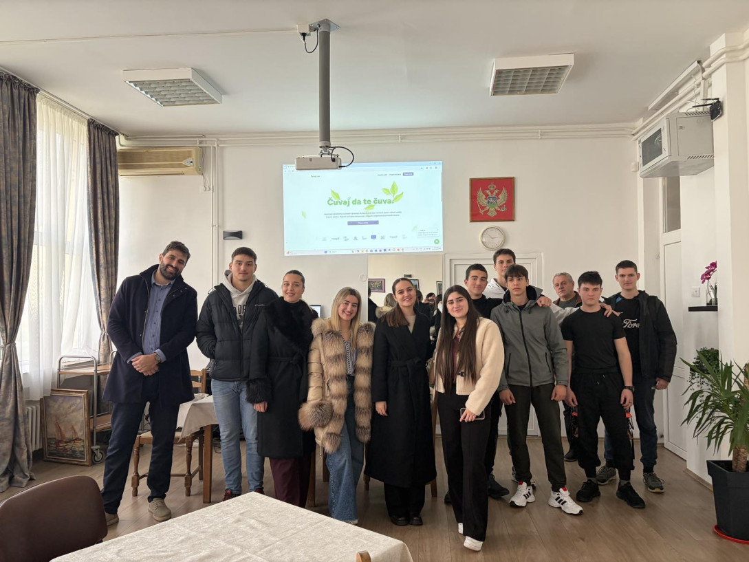 Vuk Vujisic standing with a group of pupils