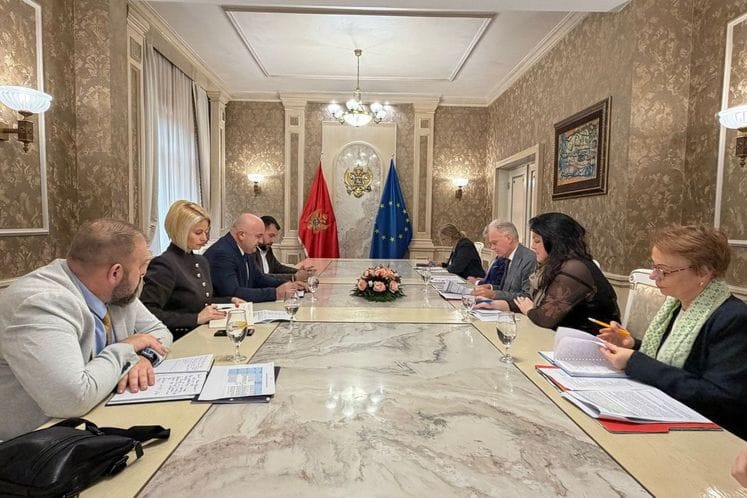 Officials sitting around a table