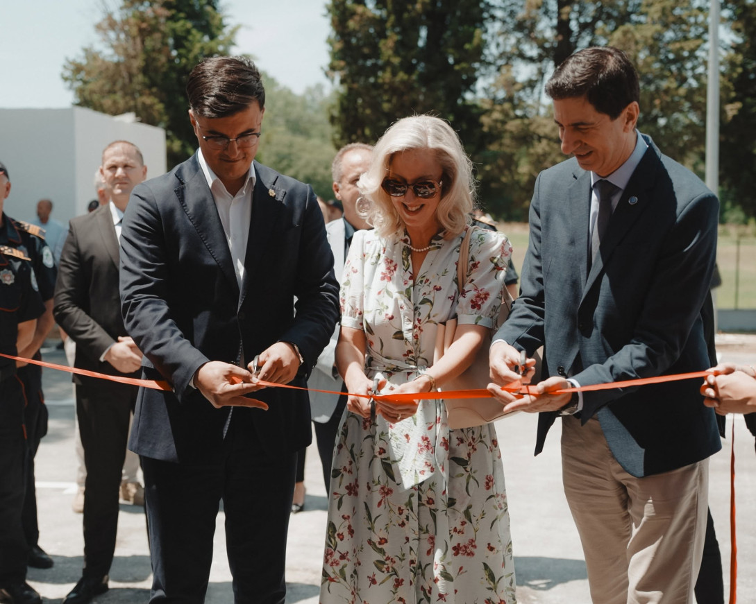 Three officials cutting the ribbon