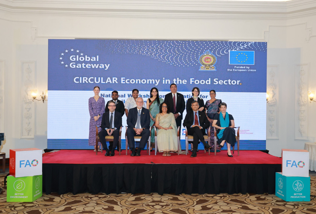Officials of the CIRCULAR peoject post in front of a backdrop