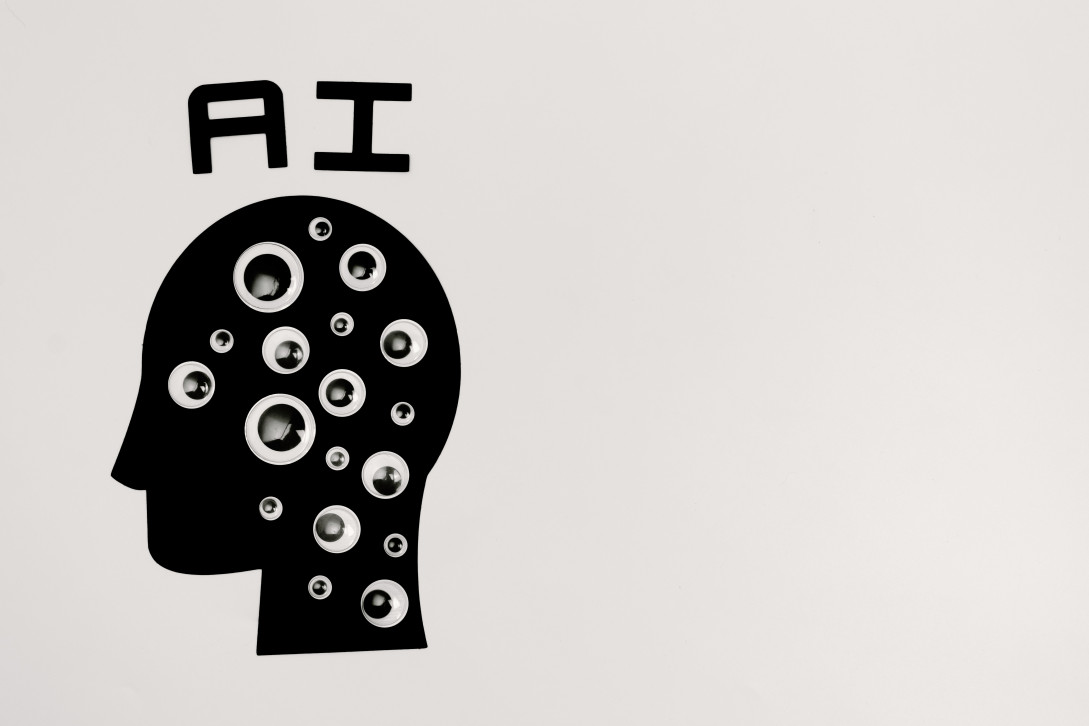 Abstract illustration of AI with silhouette head full of eyes, symbolizing observation and technolog