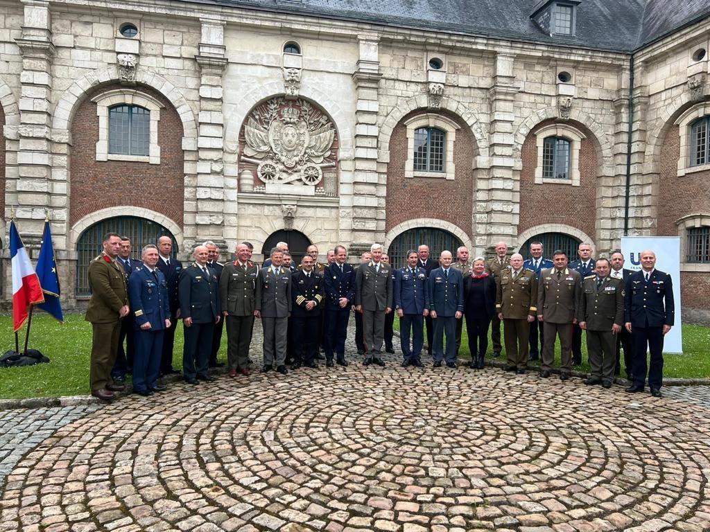 EUMC Away Day participants in front of a building