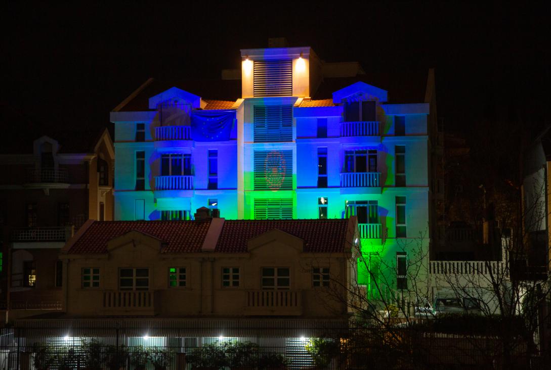 EU Delegation building lit in colours of Romani flag