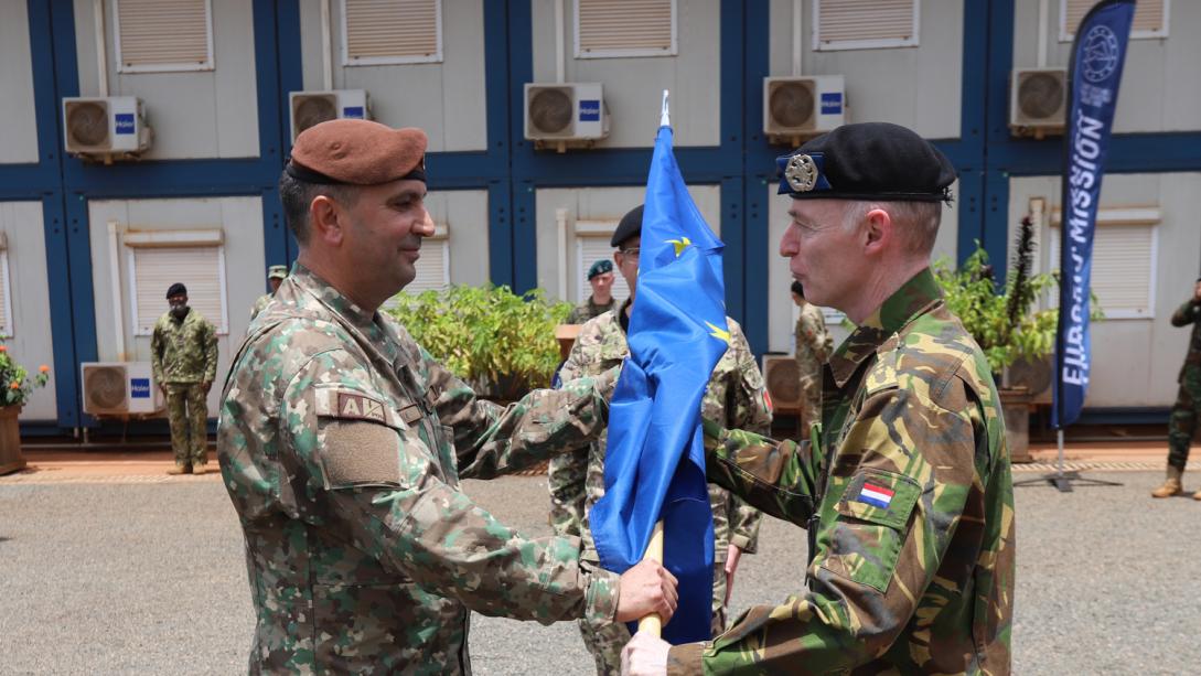 Two men greeting to each other