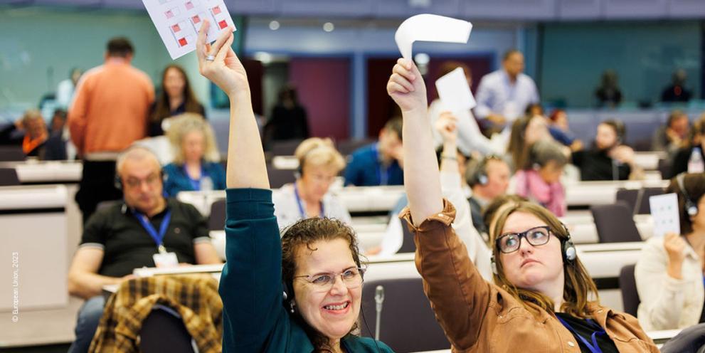 people lifting papers