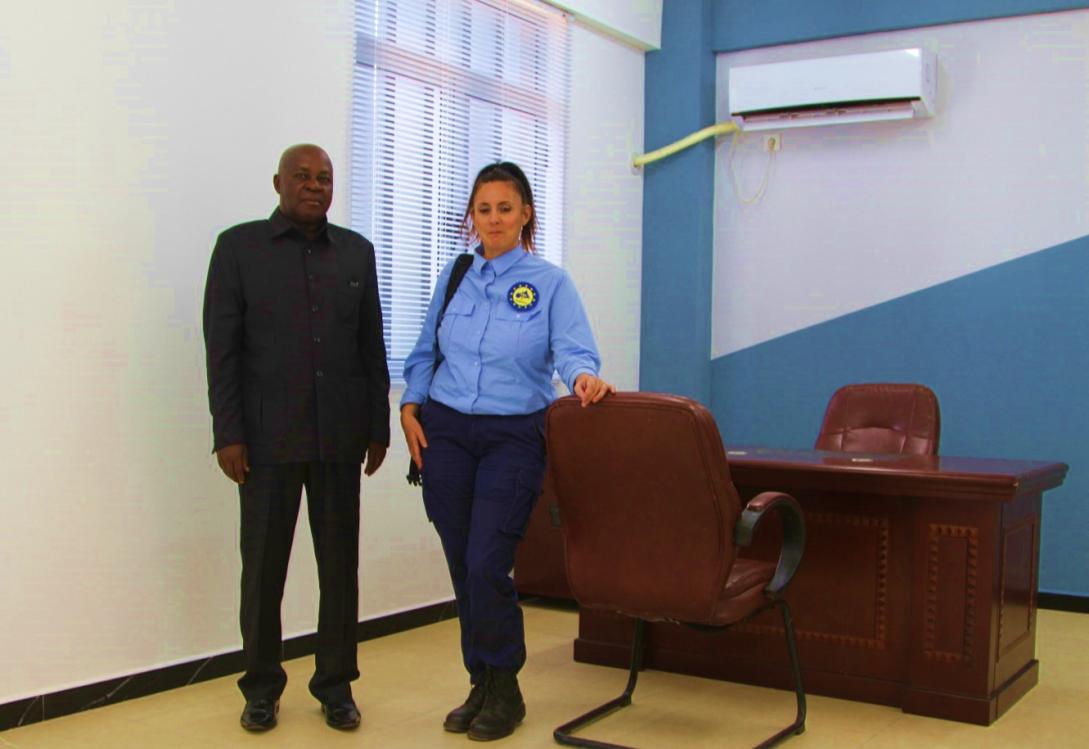 Office with two people posing