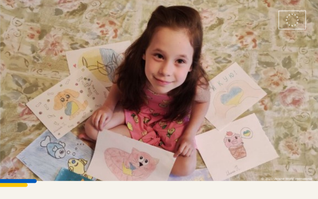 Girl sitting on the floor and surrounded by drawing