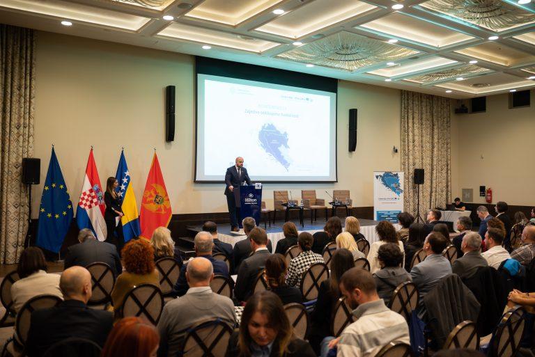Man speaking at the stage of the conference Together we shape the future