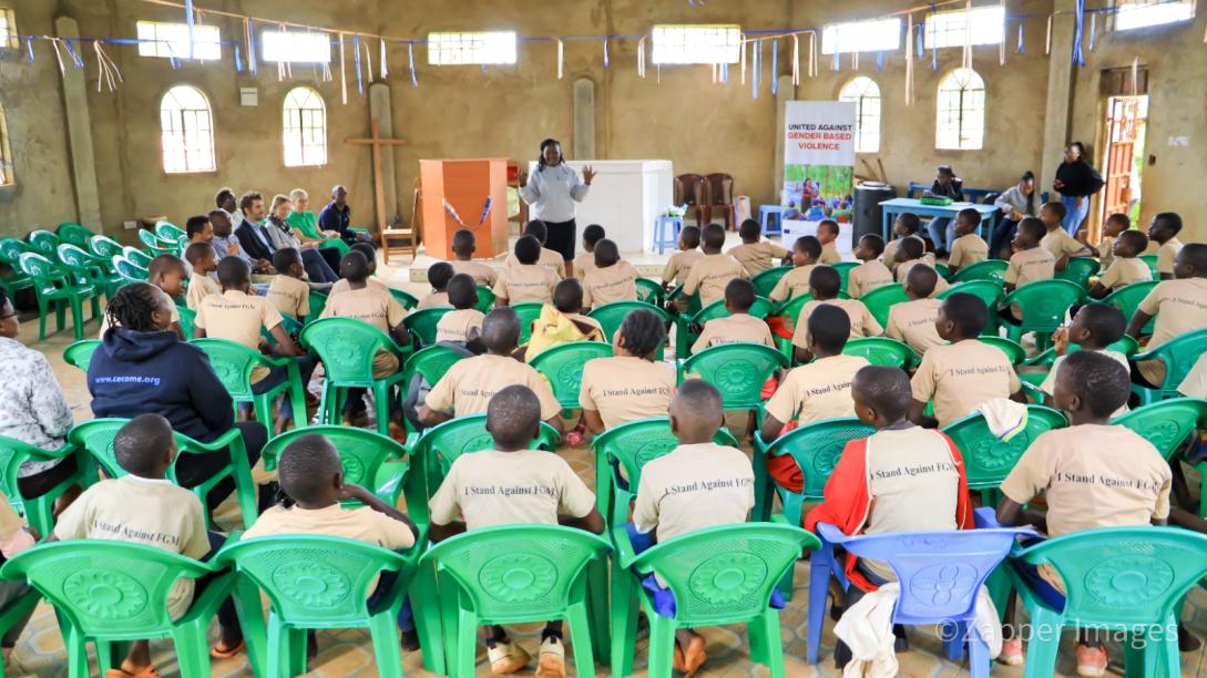 Girls listen to a lecture on the dangers of getting the traditional FGM cut