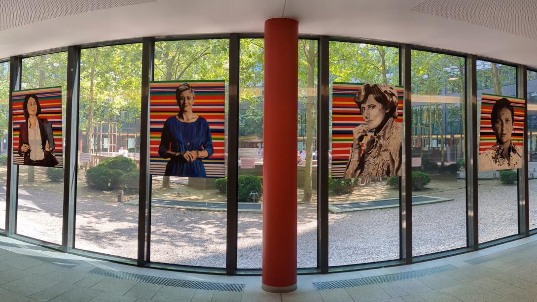 Four portraits hanging in the rotunda of the EEAS HQ