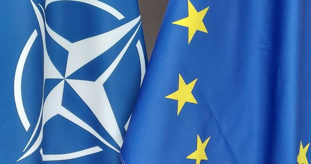 NATO and EU flags flying together