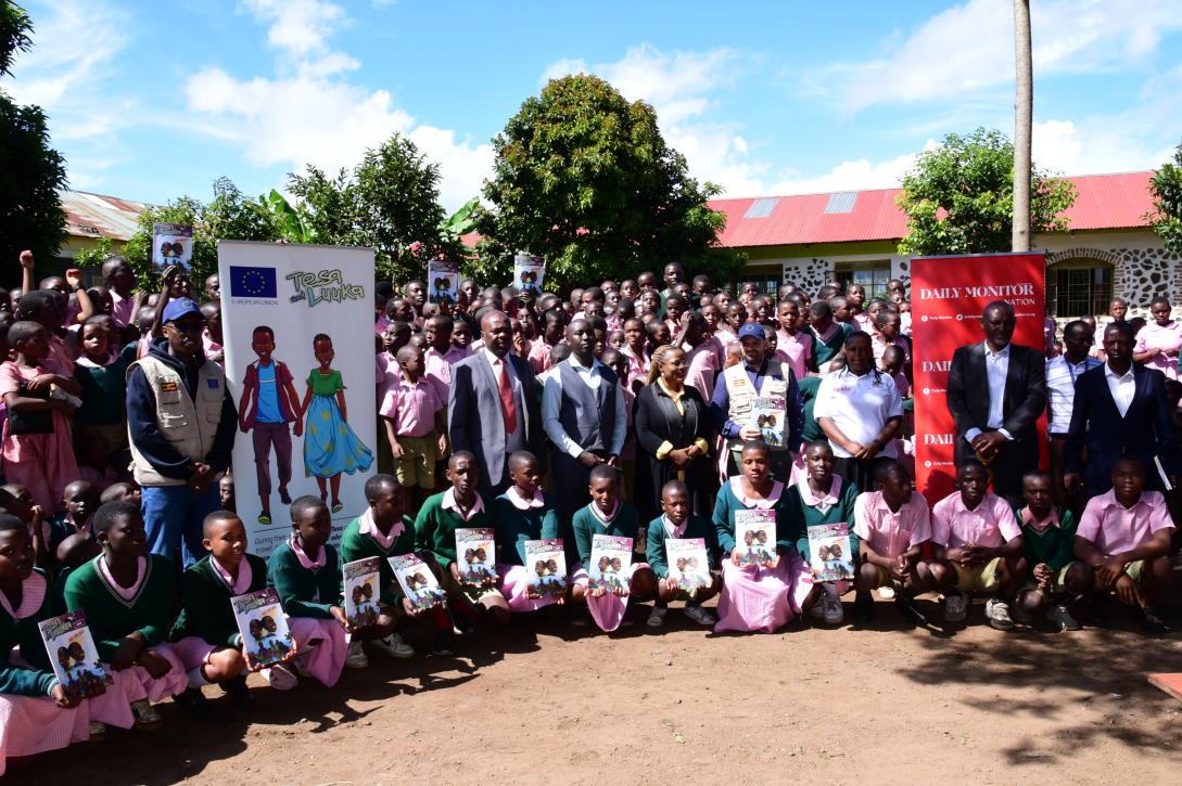 Deputy Head of the EU Delegation Guillaume Chartrain together with staff and pupils of Gisoro Primary School
