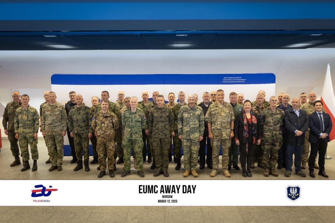 A group of EU military officers stand for a photo. 