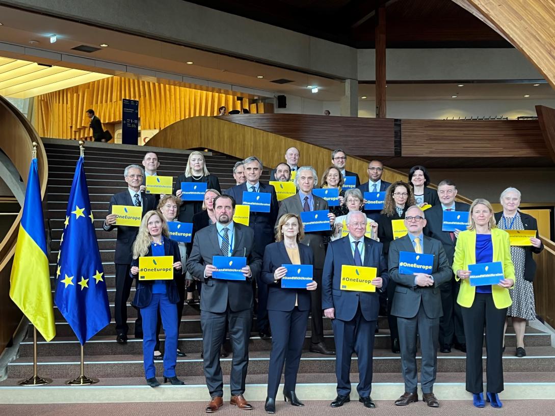 EU Ambassadors with different posters.